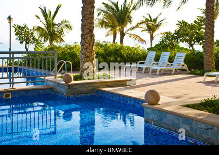 The swimming pool in one of the beach clubs on the Palm Island Jumeira in Dubai Stock Photo