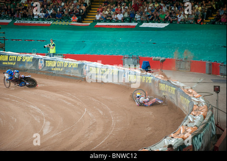 2010 British Speedway Grand Prix. Jason Crump hits the air fence after coming off his bike Stock Photo