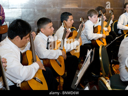 High school classical guitar ensemble performs at a conference in Austin, Texas, USA Stock Photo