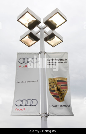 A Porsche and Audi car dealership.  Stock Photo
