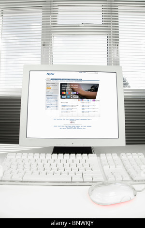 Home Computer with PayPal Internet page on the screen Stock Photo