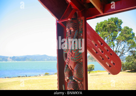 Carved wooden figure at the boathouse, overlooking Bay Of Islands, Waitangi Treaty Grounds, New Zealand. Stock Photo