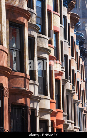 Windows on brownstone buildings Stock Photo