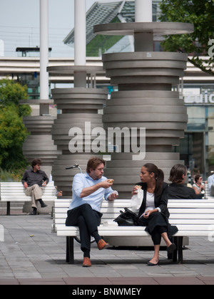 Office workers at lunch in modern business district at Amsterdam Zuid in The Netherlands Stock Photo