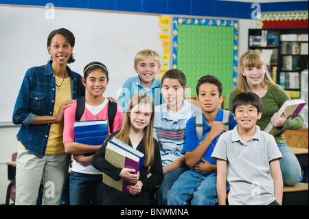 Group of elementary school students in classroom Stock Photo