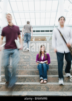 College students on steps in front of library Stock Photo