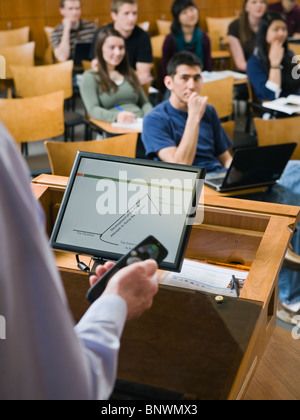 College professor giving lecture in lecture hall Stock Photo