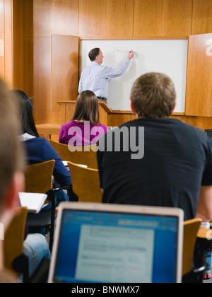 College professor giving lecture in lecture hall Stock Photo