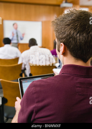 College students in lecture hall Stock Photo