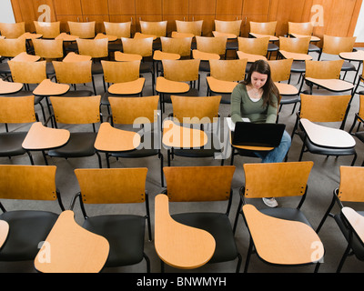 Last student left in college lecture hall Stock Photo