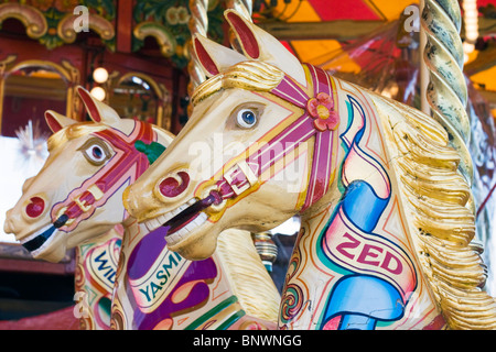 Traditional Fairground galloping horses Stock Photo