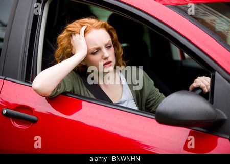 Girl sat in car Stock Photo