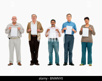 group of people standing in a row holding papers Stock Photo