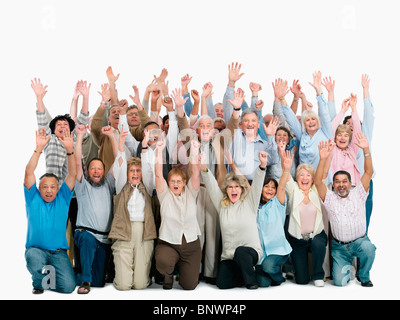 A group of people with their arms raised Stock Photo