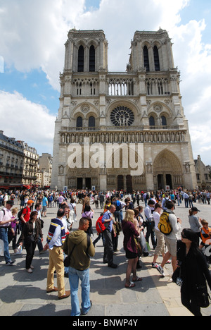 crowds of tourists in front of Notre Dame Paris France Stock Photo