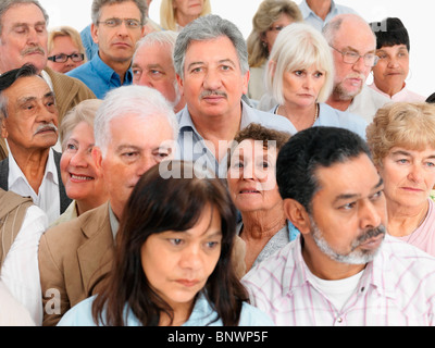 A group of serious looking people Stock Photo