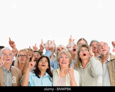 A group of shocked people pointing up Stock Photo