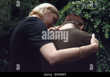 A woman consoling another woman Stock Photo