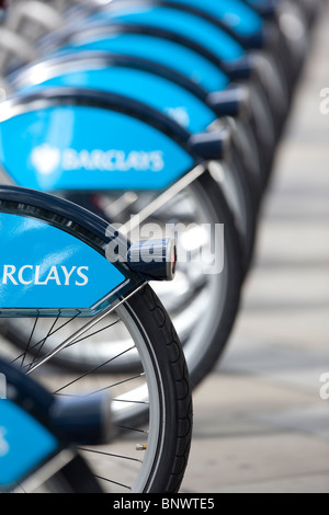 Image shows bicycle wheels lined up on a London Cycle Hire stand in the West End of London. Photo:Jeff Gilbert Stock Photo