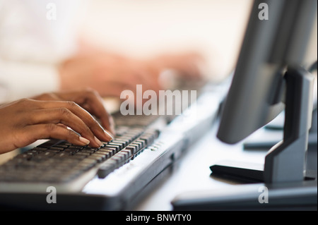 Employees working on computers in cubicles at JVP Cyber Labs a venture ...