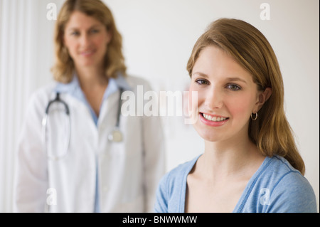 Doctor and patient in exam room Stock Photo