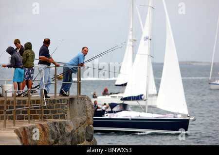 Sailing boats at the British Channel, in front of St. Peter Port, Guernsey, Channel Islands, UK, Europe. Stock Photo