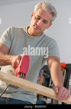 Handyman using an electric drill Stock Photo