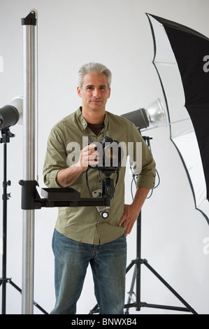 Professional photographer in his studio Stock Photo