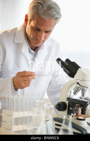Researcher working in science lab Stock Photo