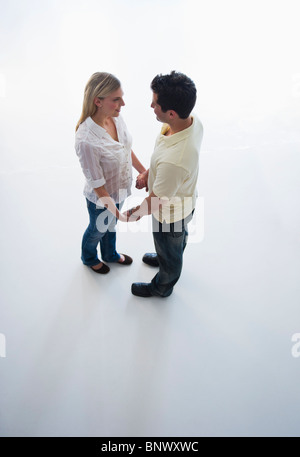 Happy couple holding hands Stock Photo