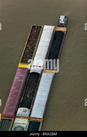 aerial view above tug boat pushing loaded barges Mississippi river Baton Rouge Louisiana Stock Photo