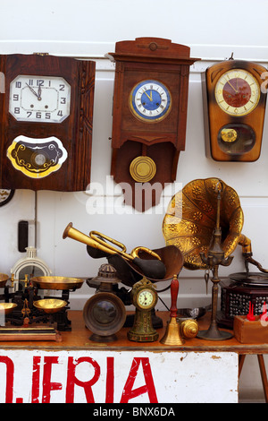 antiques fair market wall old clocks vintage stuff Stock Photo