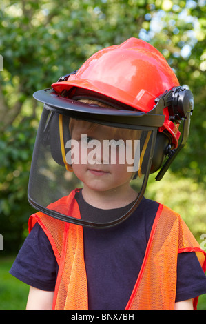 boy with building-site helmet and tools Stock Photo