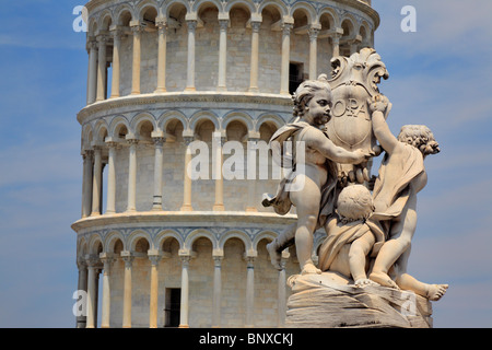 The Leaning Tower in Pisa with the top of a nearby fountain in the foreground Stock Photo