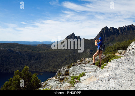 Hiker looking out over Cradle Valley from Marion's Lookout. Cradle Mountain-Lake St Clair National Park, Tasmania, AUSTRALIA Stock Photo