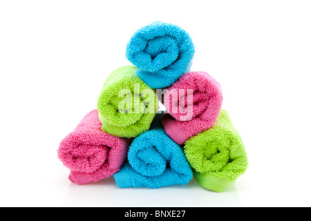 stack of colorful rolled towels isolated on white background Stock Photo