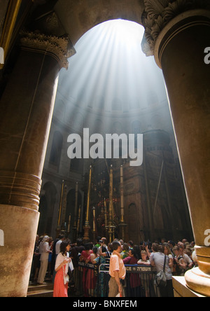 surreal rays of light flood the Church of the Holy Sepulchre in Jerusalem Stock Photo