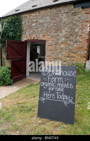 Sign outside Downhouse Farm, an organic farm meats and produce shop in Dorset, UK. Stock Photo