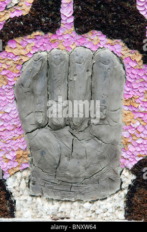 Clay fist part of a Well dressing in Bonsall in the Peak District Derbyshire Stock Photo