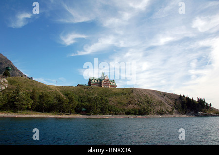 Prince of Wales Hotel on a bluff overlooking the Waterton lake Stock Photo