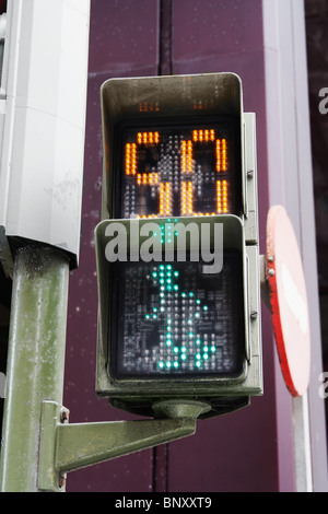 Pedestrian crossing in Spain with countdown timer. Image shows green man and 50 seconds Stock Photo