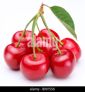 Group of ripe cherries on a white background. Stock Photo