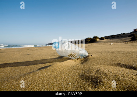 Plastic water bottle abandoned on beach, Souss-Massa National Park, Morocco Stock Photo