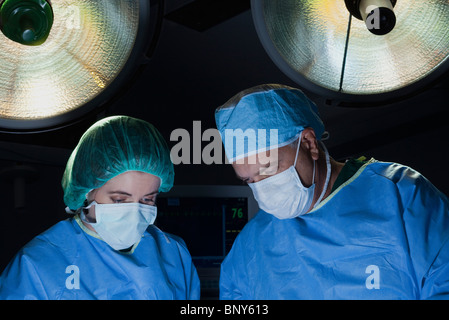Surgical team at work in operating room Stock Photo