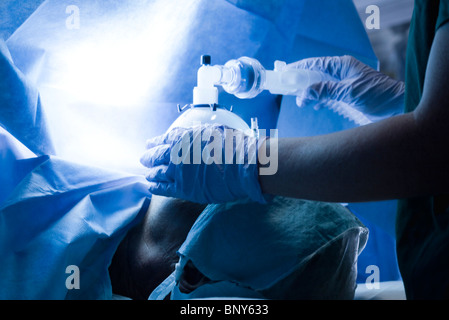 Patient receiving oxygen during operation Stock Photo