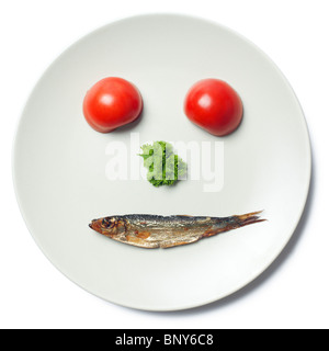 the face maked with vegetable and sprat Stock Photo