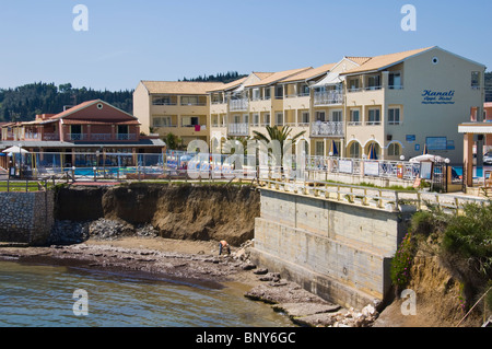 Erosion of coastal defences outside apartments at Sidari on the Greek island of Corfu Greece GR Stock Photo