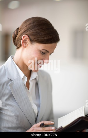 Woman checking her date book Stock Photo