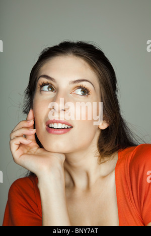 Young woman contemplatively looking away, portrait Stock Photo