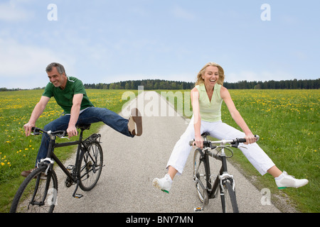 Couple riding bikes Stock Photo